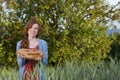 Young woman showing a fresh baken bread Royalty Free Stock Photo