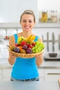 Young woman showing fruits plate Royalty Free Stock Photo