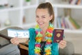 young woman showing passport and ticket