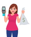 Young woman showing/holding credit, debit, ATM card swiping machine, POS payment terminal and cash, money, currency notes bag.