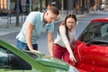 Woman Showing Man Car Collision Royalty Free Stock Photo