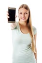 Young woman showing mobile cell phone with black screen.