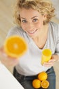 young woman showing oranges to camera Royalty Free Stock Photo