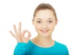 Young woman showing perfect sign. Royalty Free Stock Photo