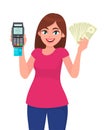 Young woman showing pos terminal or credit/debit cards swiping machine and holding cash/money/currency notes. Wireless modern bank Royalty Free Stock Photo