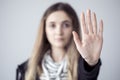 Young woman showing stop gesture open palm hand Royalty Free Stock Photo