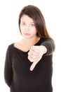 Young woman showing thumb down on white background Royalty Free Stock Photo