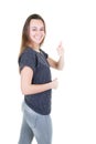 Young woman showing thumb up gesture in isolated white background Royalty Free Stock Photo