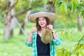 Young woman showing thumbs up in the durian farm. Asian women showing Monthong durian in the durian garden. Chanthaburi, Thailand Royalty Free Stock Photo