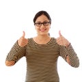 Young woman showing thumbsup gesture against white