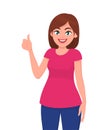 Young woman showing thumps up sign or gesture. Deal, agree, approve, positive, okay, human emotion and body language concept.