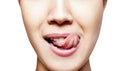 Young woman showing tongue Royalty Free Stock Photo