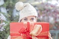 Young woman shows her gift packs inside a Christmas shop Royalty Free Stock Photo