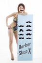 Young woman shows a panel with a set of mustaches Royalty Free Stock Photo
