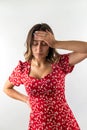 young woman is sick and has a headache isolated on a white background. Royalty Free Stock Photo