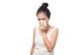 Young woman sick having allergy and sneezing in tissue isolated on white background