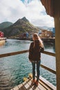 Young woman sightseeing Nyksund village in Norway