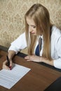 Young woman signs a contract