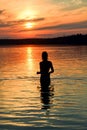 Young woman silhouette at Krasavitsa lake, Zelenogorsk, Russia Royalty Free Stock Photo