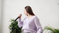 Young woman sing at home. Karaoke black microphone. House lyrics dance.