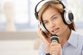 Young woman singing with microphone Royalty Free Stock Photo