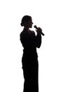 Young woman singing into the microphone Royalty Free Stock Photo