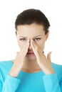 Young woman with sinus pressure pain Royalty Free Stock Photo