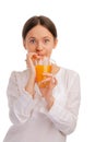 Young woman sipping juice with a straw Royalty Free Stock Photo