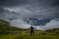 Young Solo traveler alone, has mountain, sky are background. image for travel, scenery, lonely, portrait, person, Landscape ,