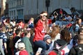 Young Woman sit on her Boyfriend`s Shoulder Watching Parader