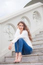 Young woman sit on stairs Royalty Free Stock Photo