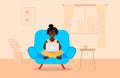 Young woman sits on the chair with a laptop in living room. Remote work or online education concept