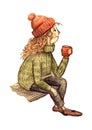 Young woman sits and drink warm tea or coffee, wearing green cozy sweater and red knitted cap. Lagom and hygge concept.