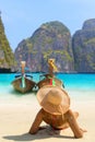 Young woman sitting on the beach at Maya Bay on Phi Phi Leh Island, Krabi Province, Thailand. Koh Phi Phi Leh is part of Mu Ko Ph Royalty Free Stock Photo