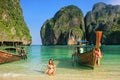 Young woman sitting on the beach at Maya Bay on Phi Phi Leh Isl Royalty Free Stock Photo