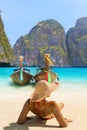 Young woman sitting on the beach at Maya Bay on Phi Phi Leh Island, Krabi Province, Thailand. Koh Phi Phi Leh is part of Mu Ko Ph Royalty Free Stock Photo