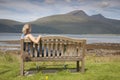 Young Woman sitting on Bench Royalty Free Stock Photo