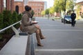 Young woman sitting on a bench Royalty Free Stock Photo