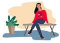 Young woman sitting on a bench. Lecture listener concept. Waiting concept. On a lesson, conference, training course