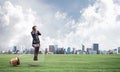 Young woman sitting on big light bulb Royalty Free Stock Photo