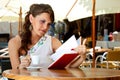 Young woman is sitting in the cafe Royalty Free Stock Photo