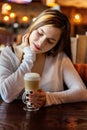 Young woman sitting in cafe Royalty Free Stock Photo