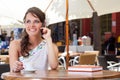 Young woman is sitting in the cafe Royalty Free Stock Photo