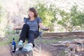 Young woman sitting chair in forest. Royalty Free Stock Photo