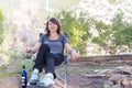 Young woman sitting chair in forest. Royalty Free Stock Photo