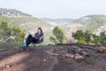 Young woman sitting chair in forest. Royalty Free Stock Photo