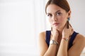 Young woman sitting on a chair isolated over white background Royalty Free Stock Photo