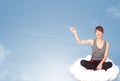 Young woman sitting on cloud with copy space Royalty Free Stock Photo