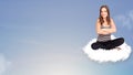 Young woman sitting on cloud with copy space Royalty Free Stock Photo
