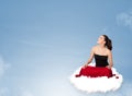 Young woman sitting on cloud with copy space Royalty Free Stock Photo